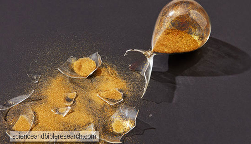 Hourglass with shattered glass and golden sand (Photo by Iaroslav Danylchenko)