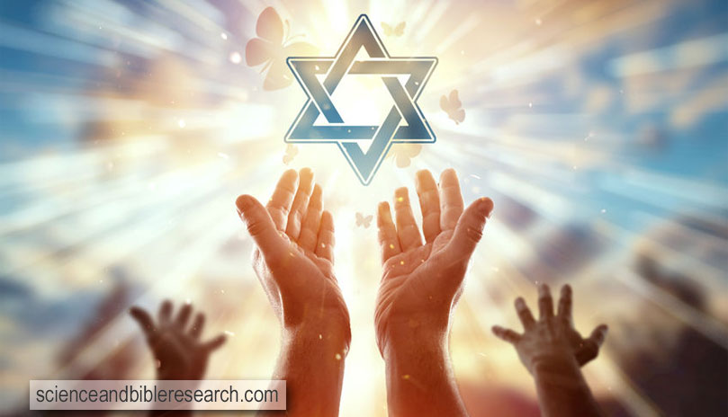 Close-up hands on the background of the symbol of Judaism, the star of David (Photo by Александр Марко)
